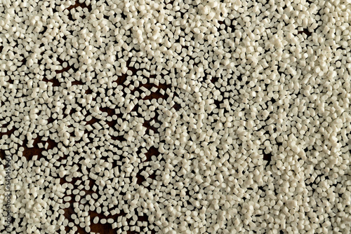 Close-up of plastic polymer granules, hand hold Polymer pellet, polymer plastic, compound polymer, Technology product of plastic chemical, green polymer, resin from petrochemical, photo