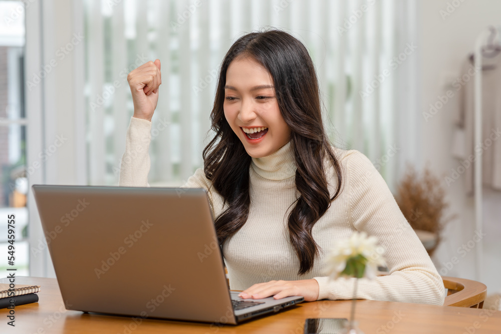 Entrepreneur beautiful business asian young woman working online with laptop and celebrating at home with her work success cheerful and happiness. Small Business Startup concept. Surprise and excite Entrepreneur beautiful business asian young woman working online with laptop and celebrating at home with her work success cheerful and happiness. Small Business Startup concept. Surprise and excite