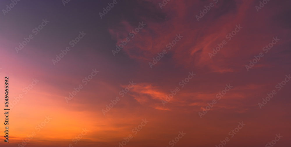 Sunset sky in the evening on twilight with orange, red sunlight clouds, Dusk sky background 