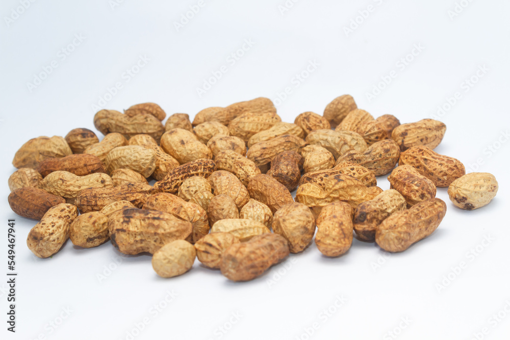 Photo of a bunch of peanuts. Isolated on white background. Photo of a bunch of peanuts. Isolated on white background.