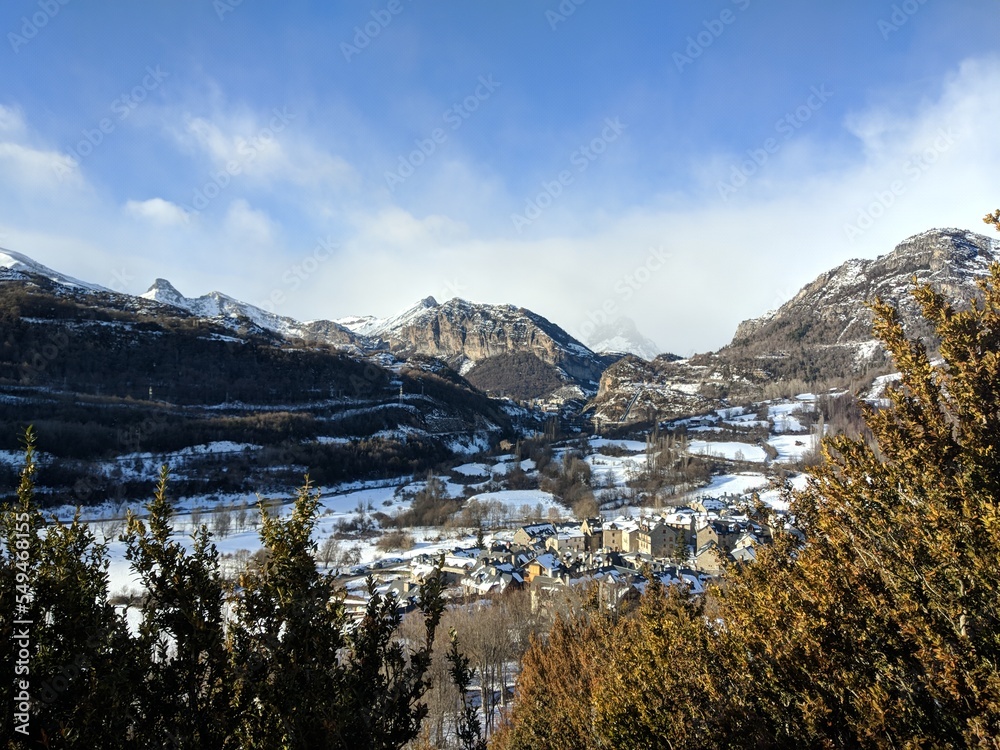 Winter landscape with a view of a snowy mountain.
