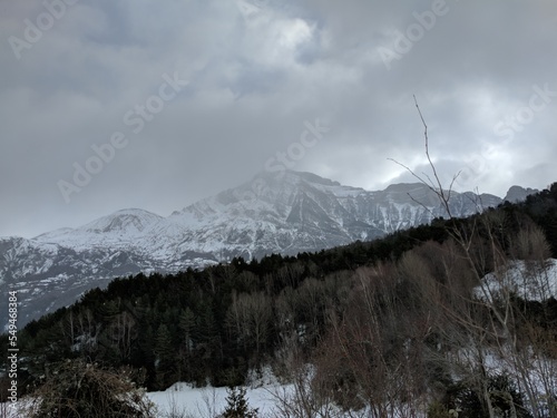 Winter landscape with a view of a snowy mountain. photo