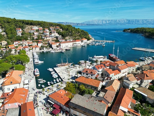 Boats moored in harbour Jelsa Croatia town on Hvar drone aerial view