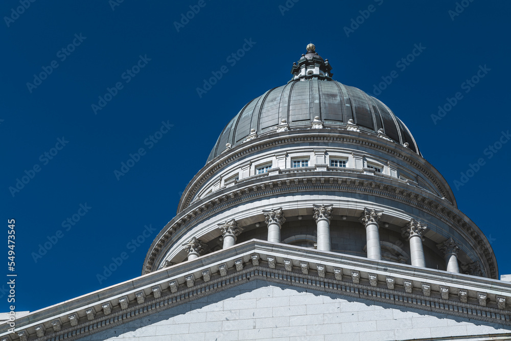 The architecture of buildings windows, stucco molding, and columns on a sunny day in the USA. High-quality photo