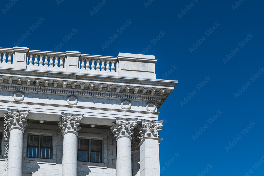 The architecture of buildings windows, stucco molding, and columns on a sunny day in the USA. High-quality photo