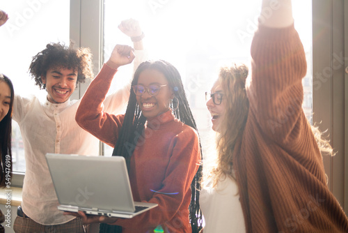 Small group of people in the office, is checking on the laptop the results obtained at work 