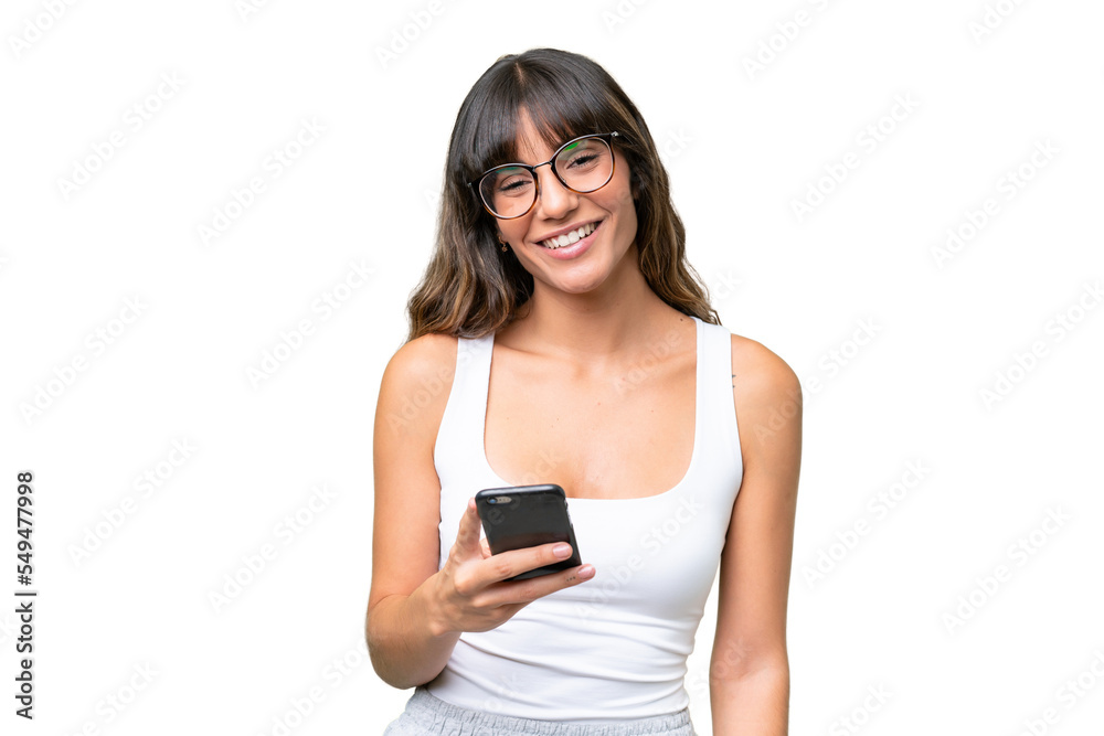 Young caucasian woman over isolated background using mobile phone Young caucasian woman over isolated background using mobile phone