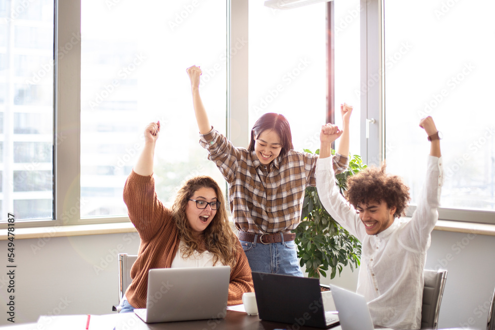 © jessica - Small group of people is rejoicing over an achievement