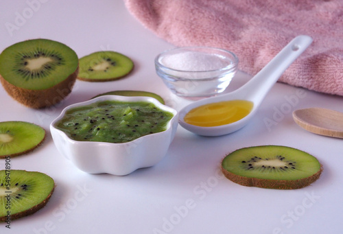 DIY kiwi fruit beauty mask (scrub) for face or hair in a glass bowl