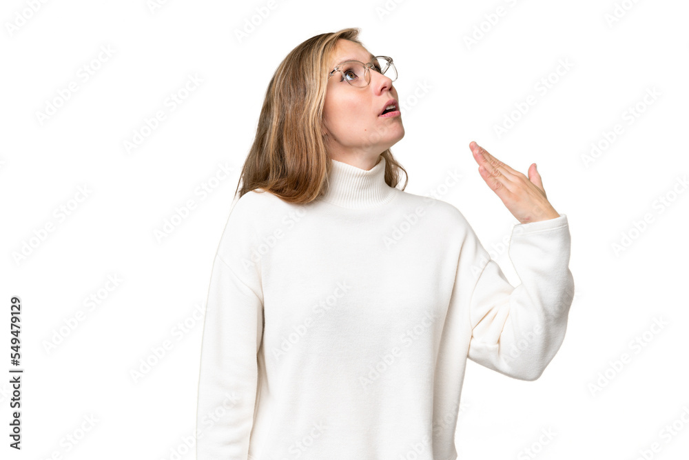 Young blonde woman over isolated background with tired and sick expression Young blonde woman over isolated background with tired and sick expression