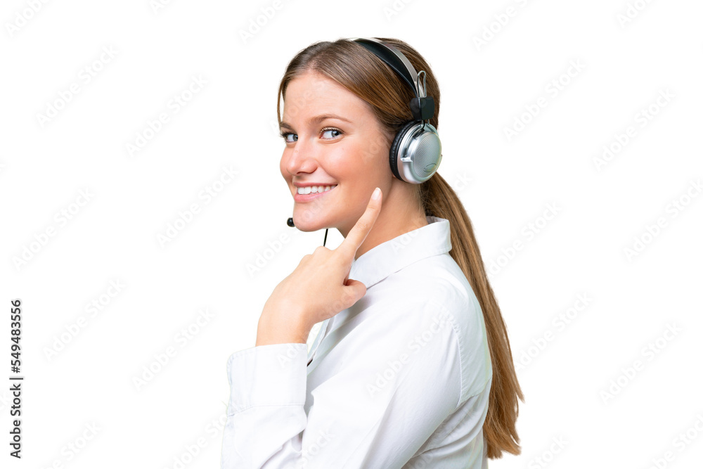 Telemarketer caucasian woman working with a headset over isolated background and pointing it Telemarketer caucasian woman working with a headset over isolated background and pointing it
