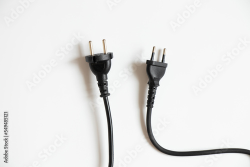 Two black cables with plugs on a white background, cable