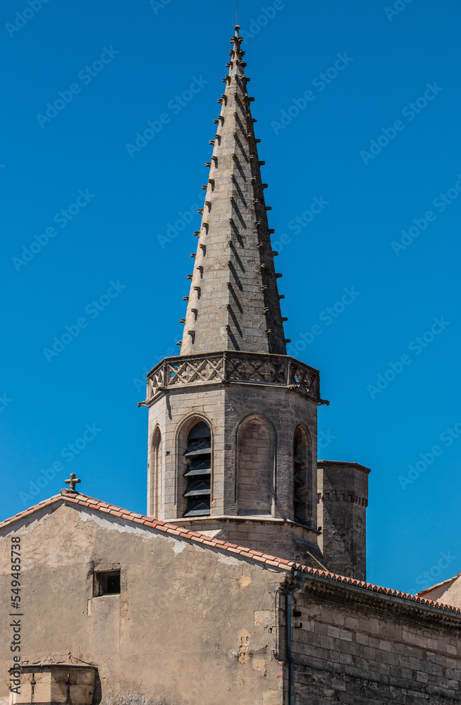 The church in the center of Arles, opposite the Arles amphitheater. Provence region in France. Église Couvent des Cordeliers. Catholic church.