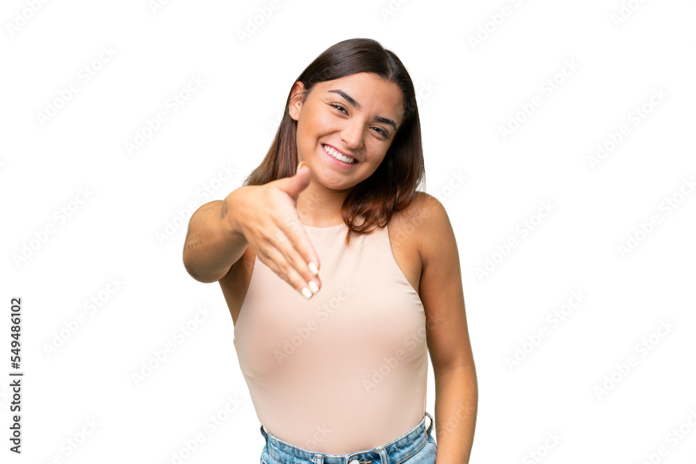 Fototapeta premium Young caucasian woman isolated on green chroma background shaking hands for closing a good deal