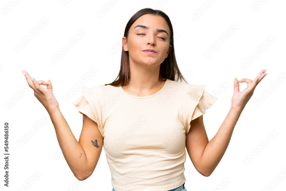 Young caucasian woman isolated on green chroma background in zen pose Young caucasian woman isolated on green chroma background in zen pose