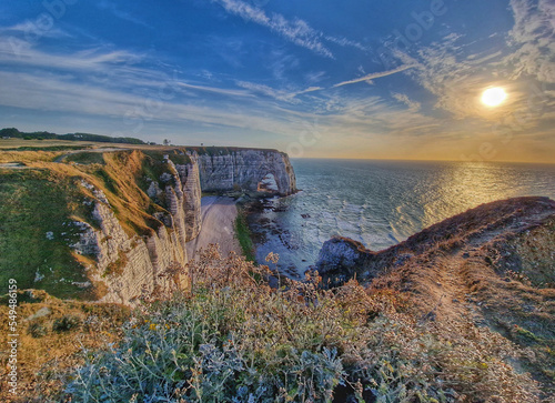 The famous cliffs of Etretat, Normandy, France. Limestone white cliffs in Northern France. La Falaise d'Amont.