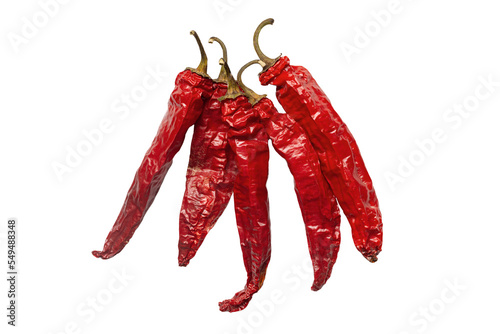 Dried red chili pepper on white background. Studio photo of red hot pepper on white background. Dried red chili or cayenne chili pepper isolated on white background. 5 dried hot peppers. 
