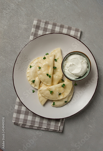 Fototapeta Naklejka Na Ścianę i Meble -  Pierogi, a traditional dish of Polish cuisine, dumplings, top view, close-up, no people,