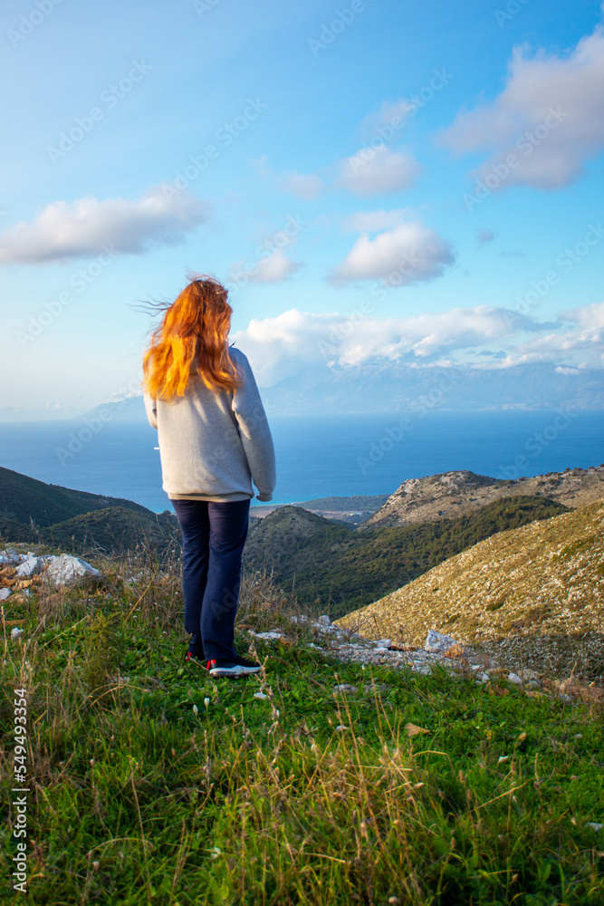 woman looking on the top of the mountain