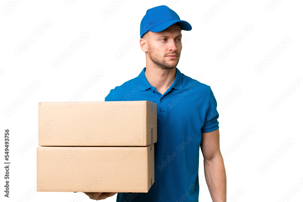 Delivery caucasian man over isolated background looking to the side Delivery caucasian man over isolated background looking to the side
