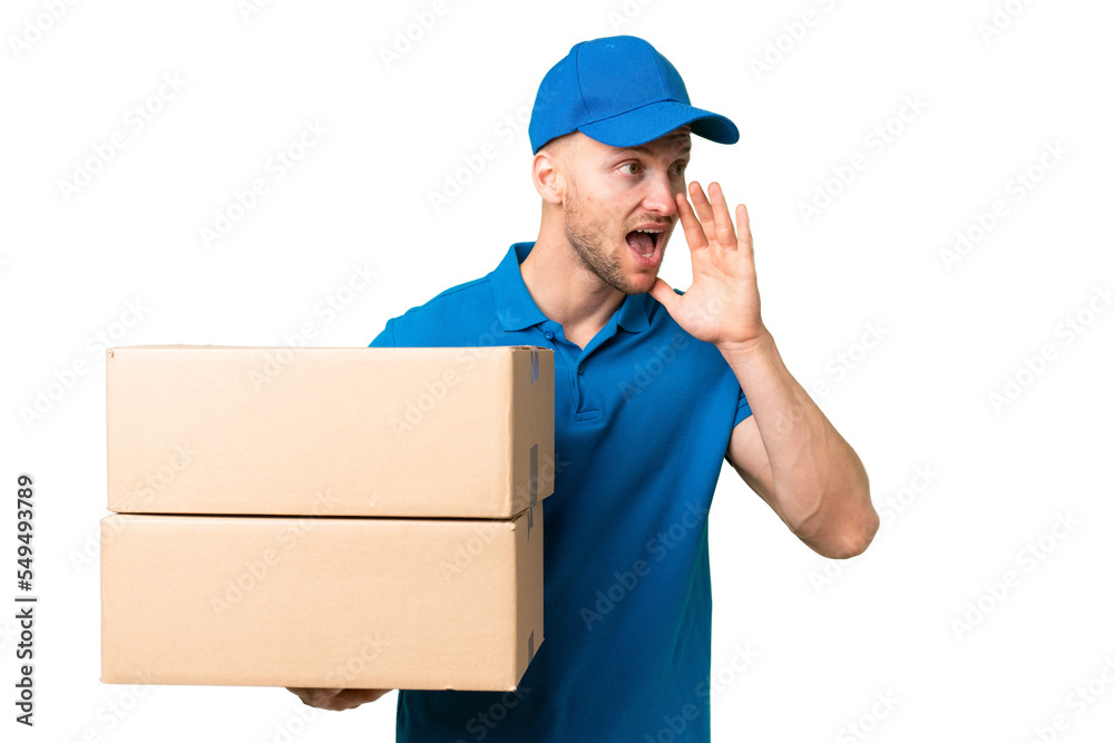 Delivery caucasian man over isolated background shouting with mouth wide open to the side Delivery caucasian man over isolated background shouting with mouth wide open to the side
