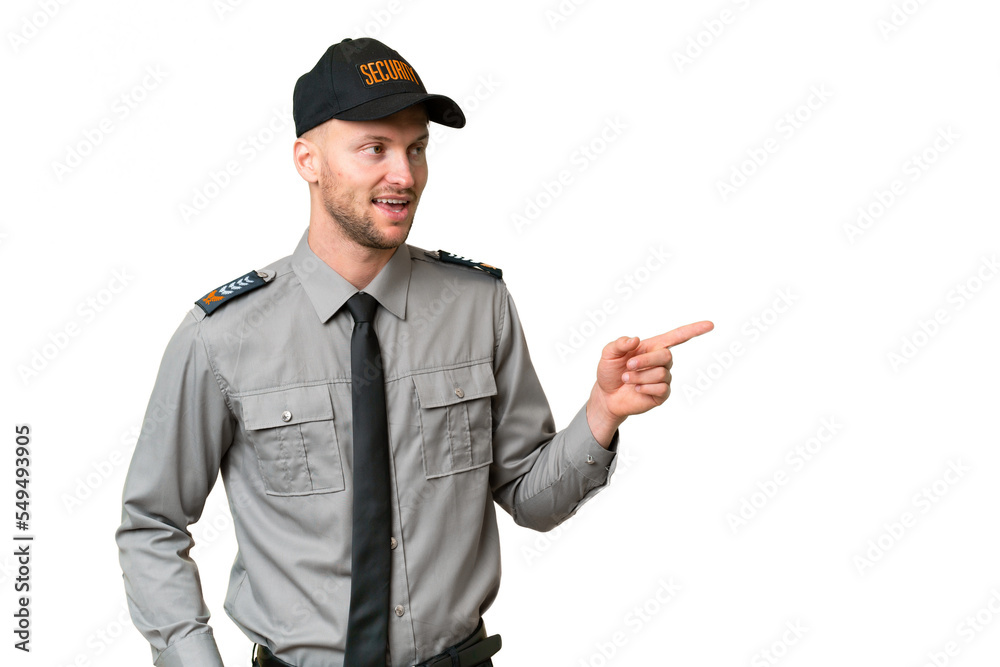 Young security caucasian man over isolated background pointing finger to the side and presenting a product Young security caucasian man over isolated background pointing finger to the side and presenting a product
