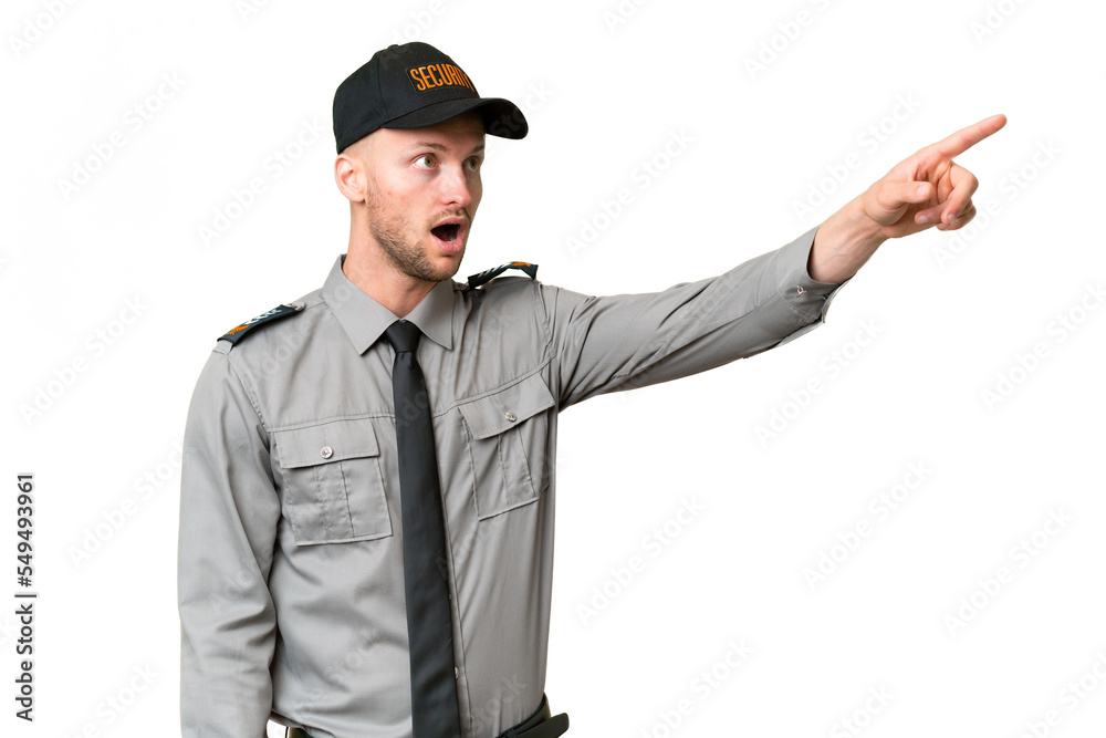 Young security caucasian man over isolated background pointing away Young security caucasian man over isolated background pointing away
