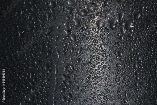Foto Black surface of wet drops texture background