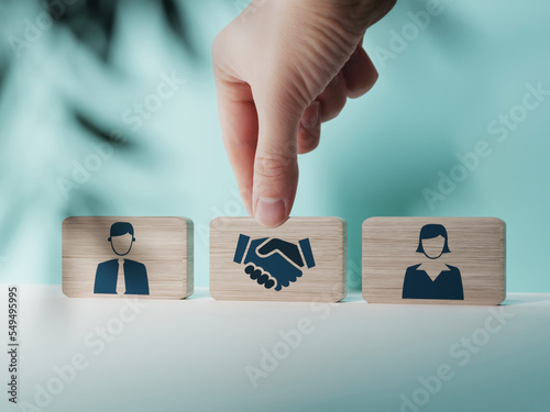Wooden blocks with an icon of a woman and a man and mediation. Concept of mediation between spouses, divorce. Divorce proceedings before the Court. The role of the mediator... photo