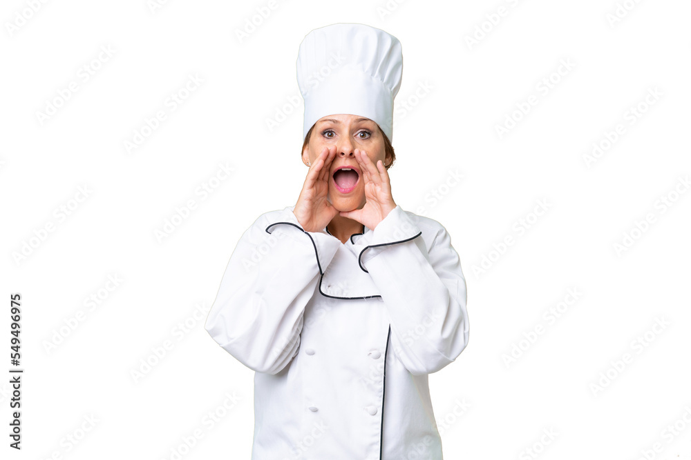 Middle-aged chef woman over isolated background shouting and announcing something Middle-aged chef woman over isolated background shouting and announcing something