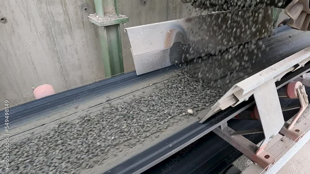Belt conveyor transporting limestone aggregate in asphalt production 4k.