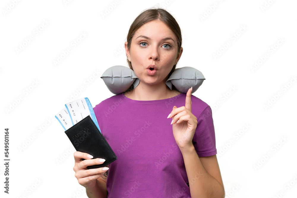 Young beautiful blonde woman with Inflatable travel Pillow over isolated background intending to realizes the solution while lifting a finger up Young beautiful blonde woman with Inflatable travel Pillow over isolated background intending to realizes the solution while lifting a finger up