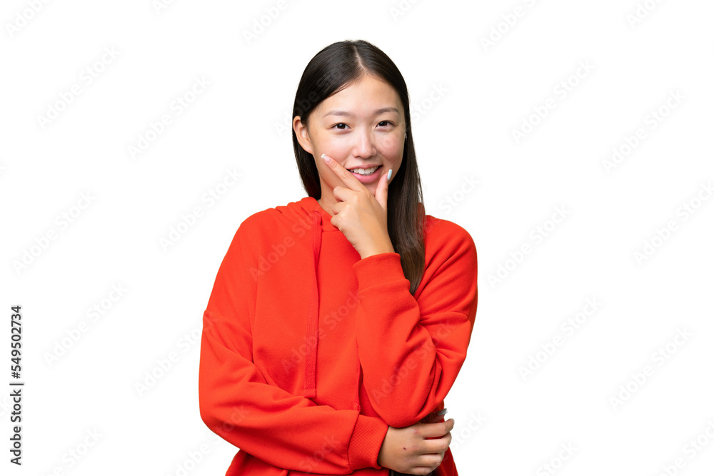 Young Asian woman over isolated background holding copyspace imaginary on the palm to insert an ad Young Asian woman over isolated background holding copyspace imaginary on the palm to insert an ad