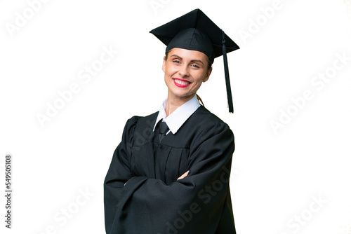 Young university graduate caucasian woman over isolated background with arms crossed and looking forward