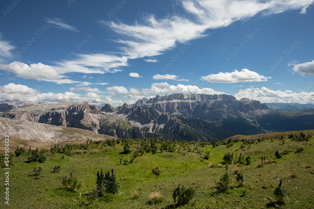 wide view of an alpine valley among the Dolomites in Val Gardena (Sella group in the background)