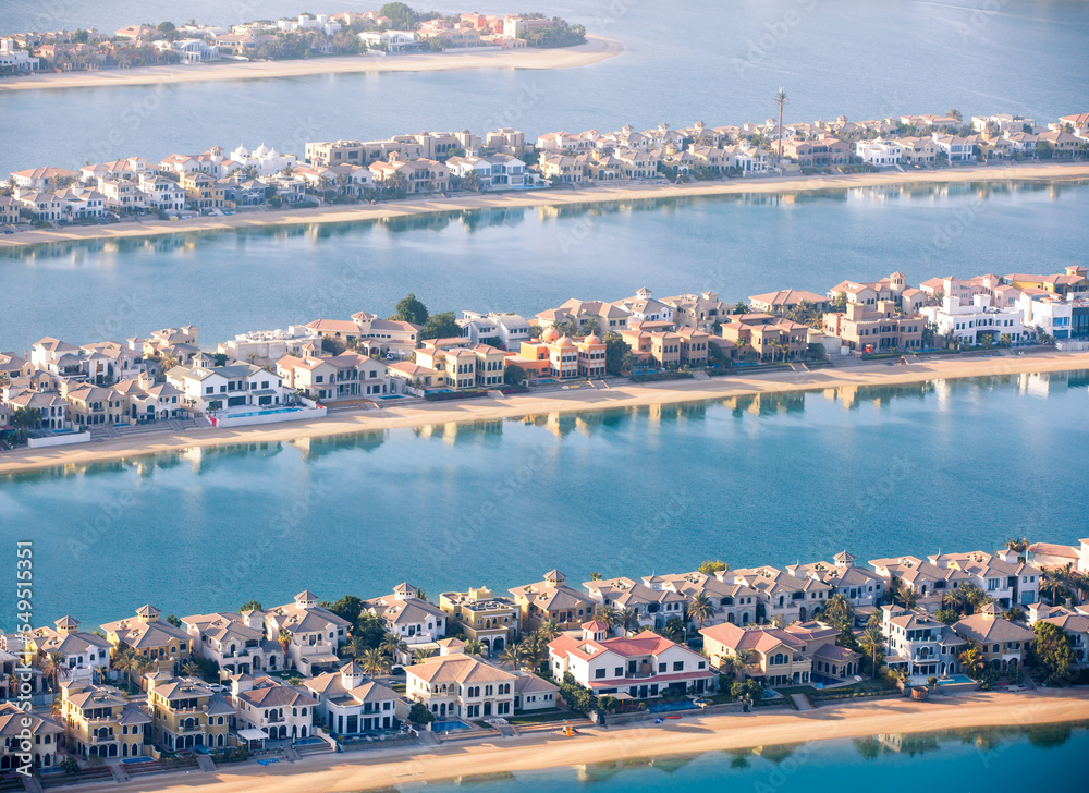 The Palm Jumeirah. Holidays villas and luxury hotels view at sunset. Dubai, UAE	