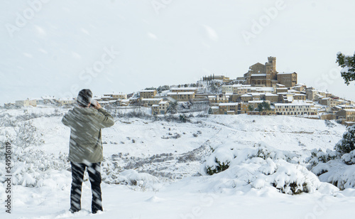 Photographing the snowy medieval village environment during the blizzard.