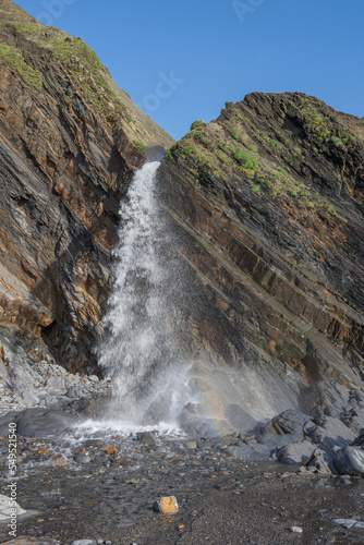 Waterfall on Sandymouth beach