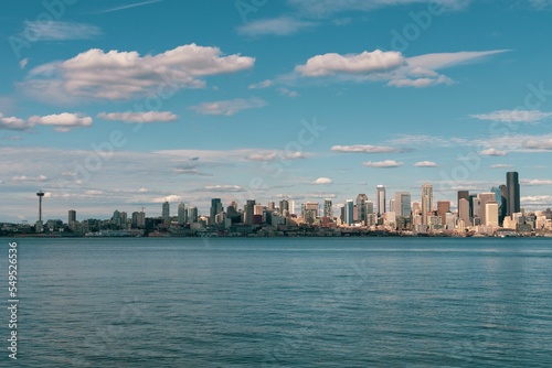 View of a beautiful Seattle city from Alki beach and a tranquil sea photo