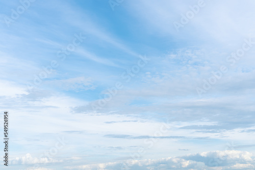 White and blue sky with haze from clouds. © Viktoria