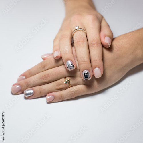 Nail Polish. Modern style pink Nail Polish.Stylish pastel Color white milk Nails hold. Classic wedding bride nails design.Stylish trendy female manicure. Beautiful young woman hand.