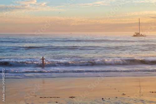 woman at sunset at the beach