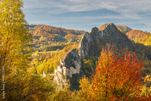 View of autumn landscape with The Lednica medieval castle in the White Carpathian Mountains, Slovakia, Europe. photo