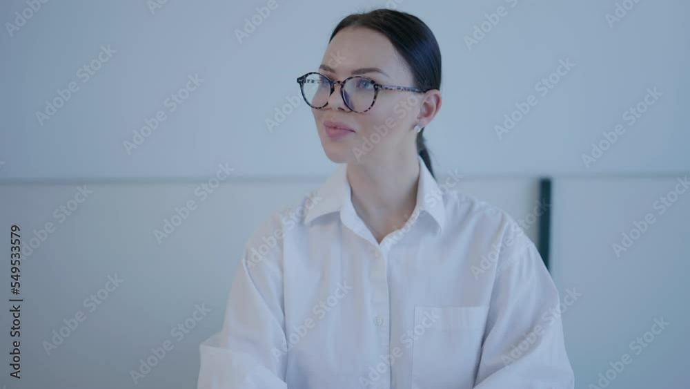 Young entrepreneur using a tablet for the video call with colleagues. Beautiful female professor teaches students remotely during online class. High quality 4k footage Young entrepreneur using a tablet for the video call with colleagues. Beautiful female professor teaches students remotely during online class. High quality 4k footage