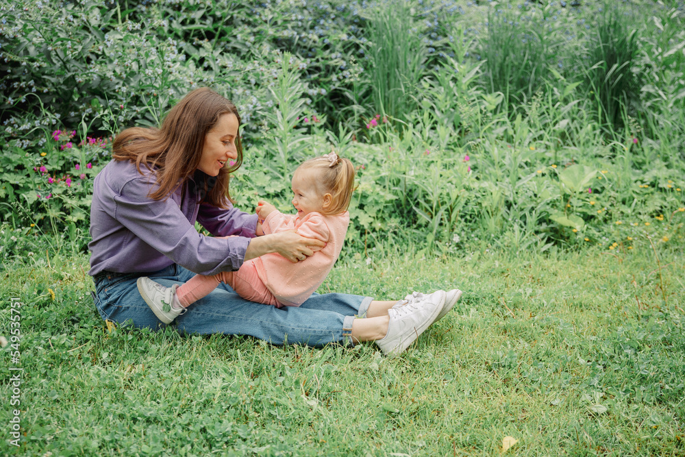 Fototapeta premium parent and child playing in the garden
