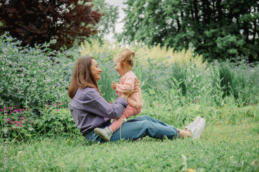 mother and child in park. family fun mother and child in park. family fun