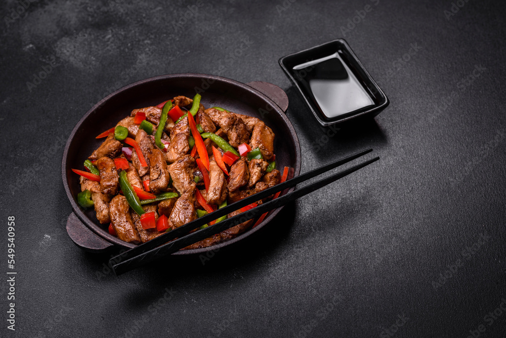 Delicious Asian teriyaki meat with red and green bell peppers