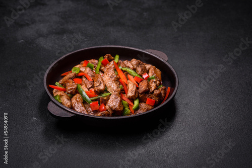 Delicious Asian teriyaki meat with red and green bell peppers