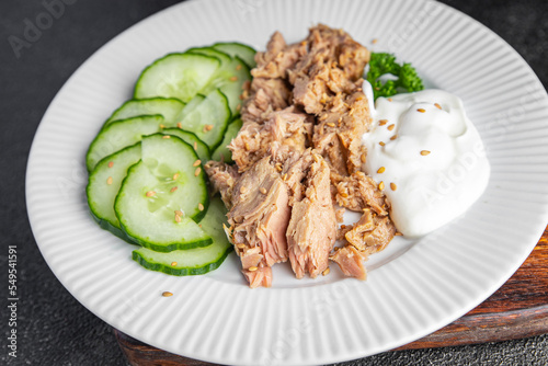 tuna salad, cucumber and yogurt or sour cream fresh delicious snack healthy meal food snack on the table copy space food background rustic top view keto or paleo diet veggie vegan or vegetarian food 