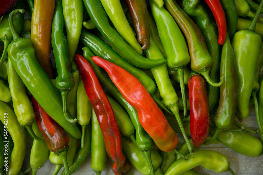 Hot chili pepper background. Red and green peppercorns as a background. Healthy food concept.
